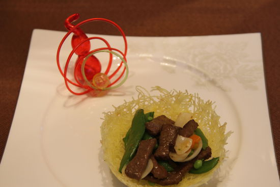 雀巢爆羊柳。 花惠生 供圖